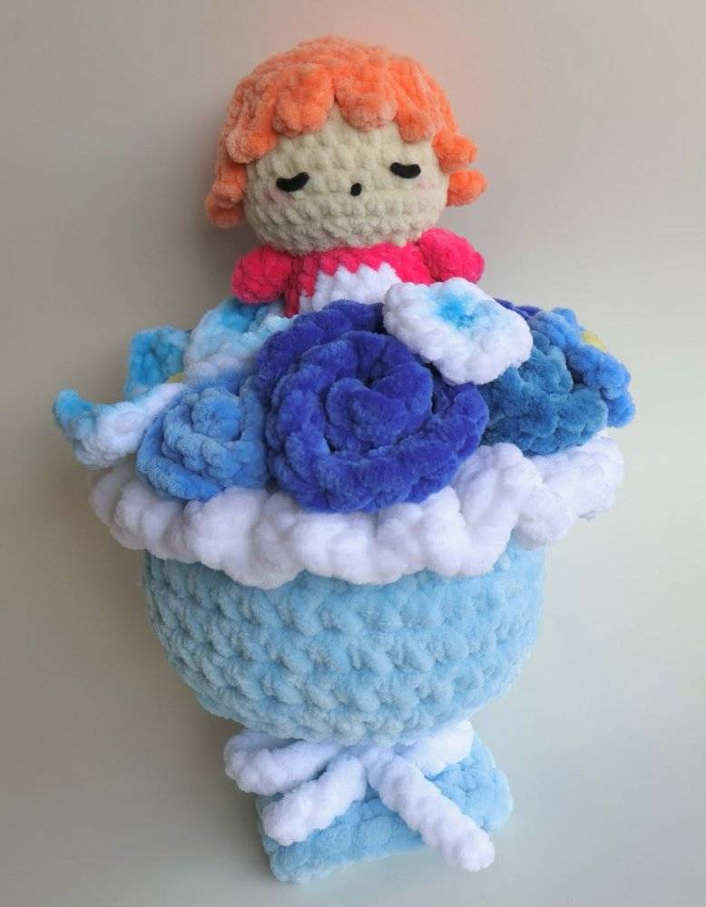 Plush Crochet Doll with Floral Arrangement