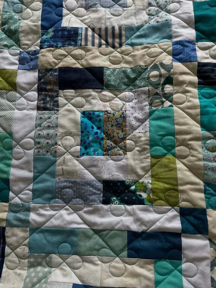Patchwork Quilt with Teal, Blue, and Green Hues