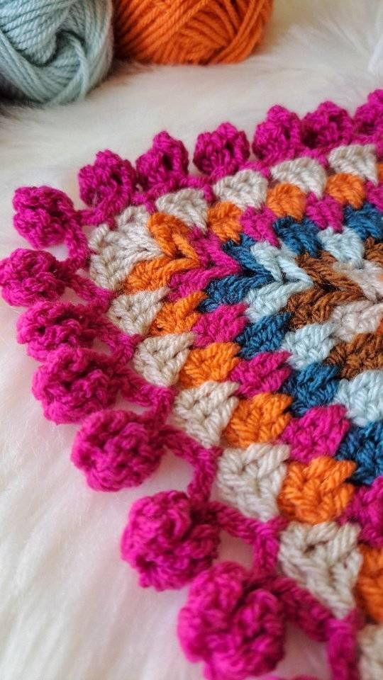 Vibrant Crochet Granny Square Coaster with Pom-Pom Edging