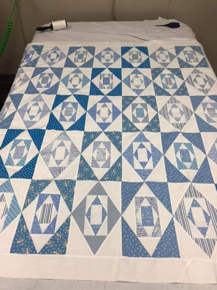 Classic Blue and White Geometric Quilt Design