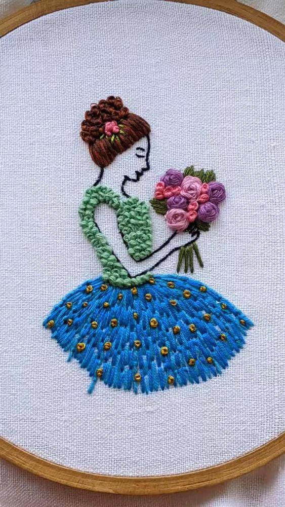 Embroidered Girl Holding a Flower Bouquet
