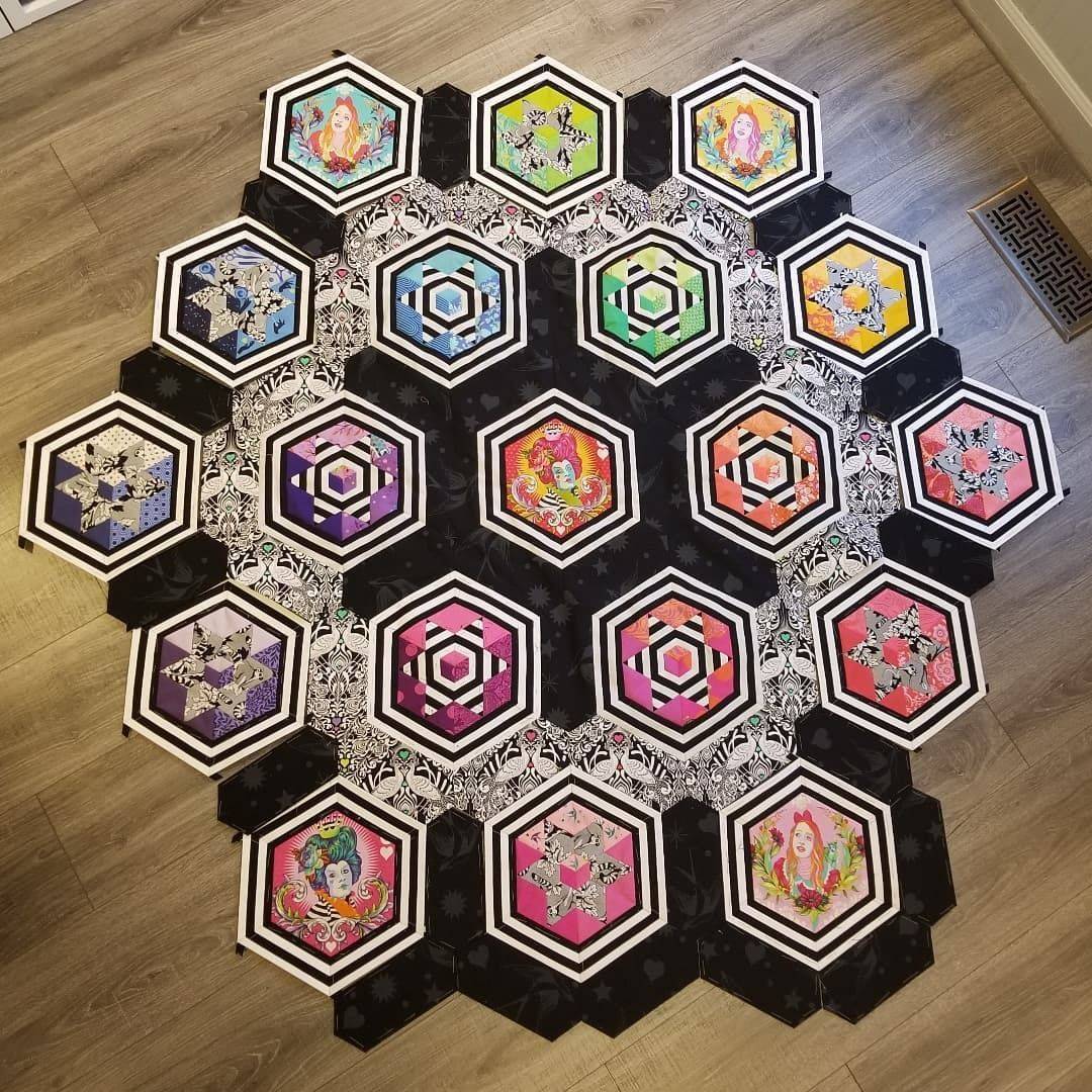 Geometric Hexagon Quilt with Whimsical Fabric Appliqués