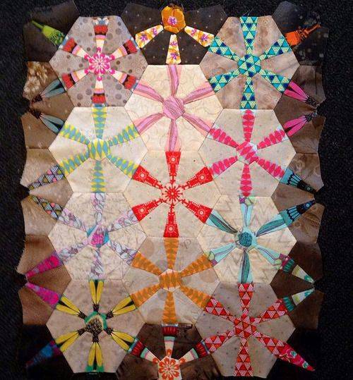 Hexagonal Patchwork Quilt with Starburst Blocks