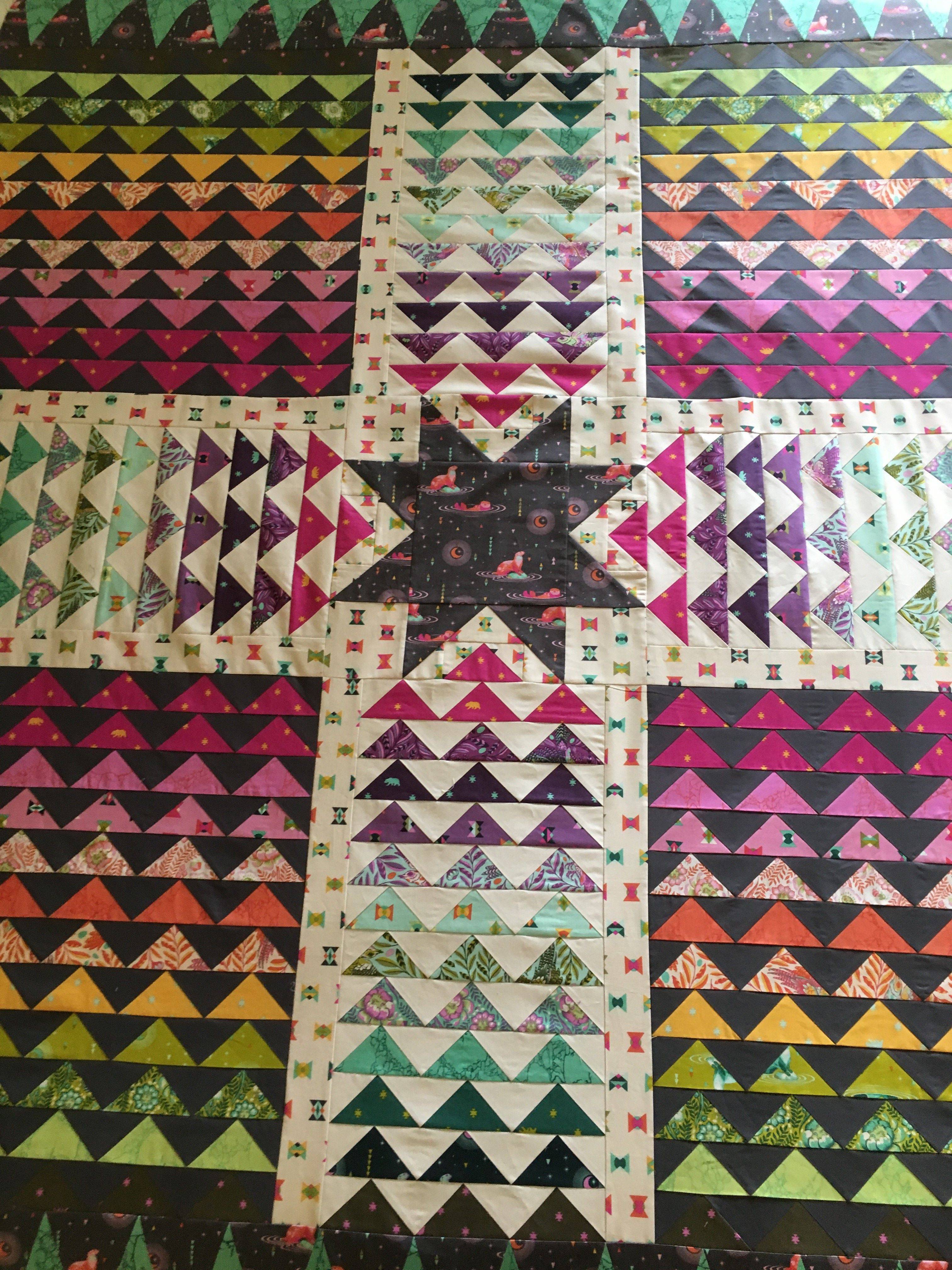 Vibrant Geometric Triangle Quilt Design