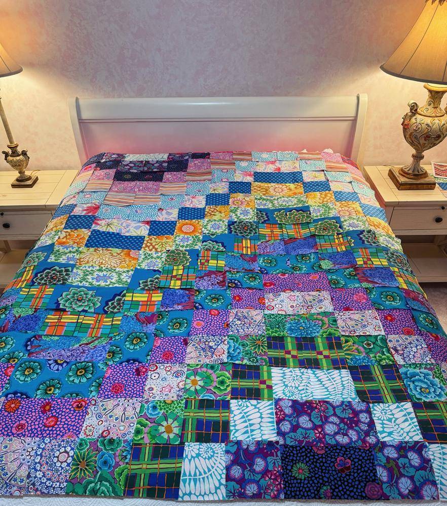 Patchwork Fabric Quilt with Vibrant Floral Patterns