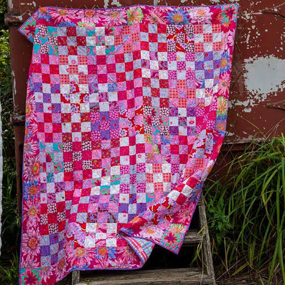 Patchwork Square Quilt with Vibrant Floral Borders