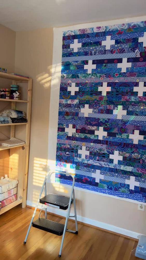 Strip Pieced Quilt with Plus Sign Blocks