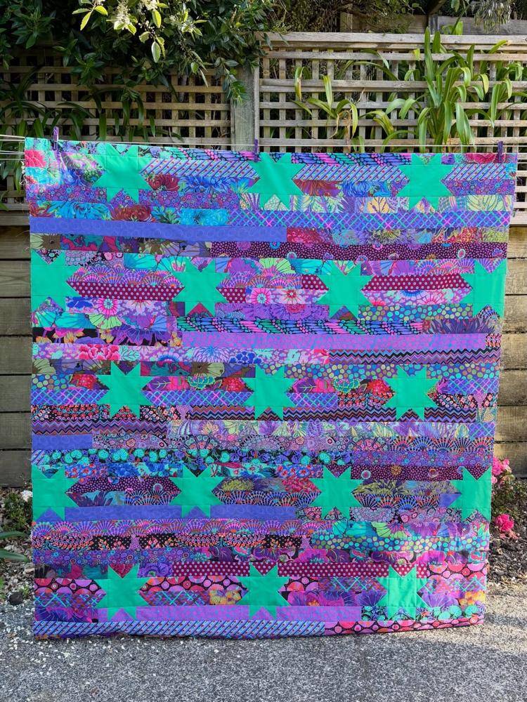 Strip Quilt with Star Accents