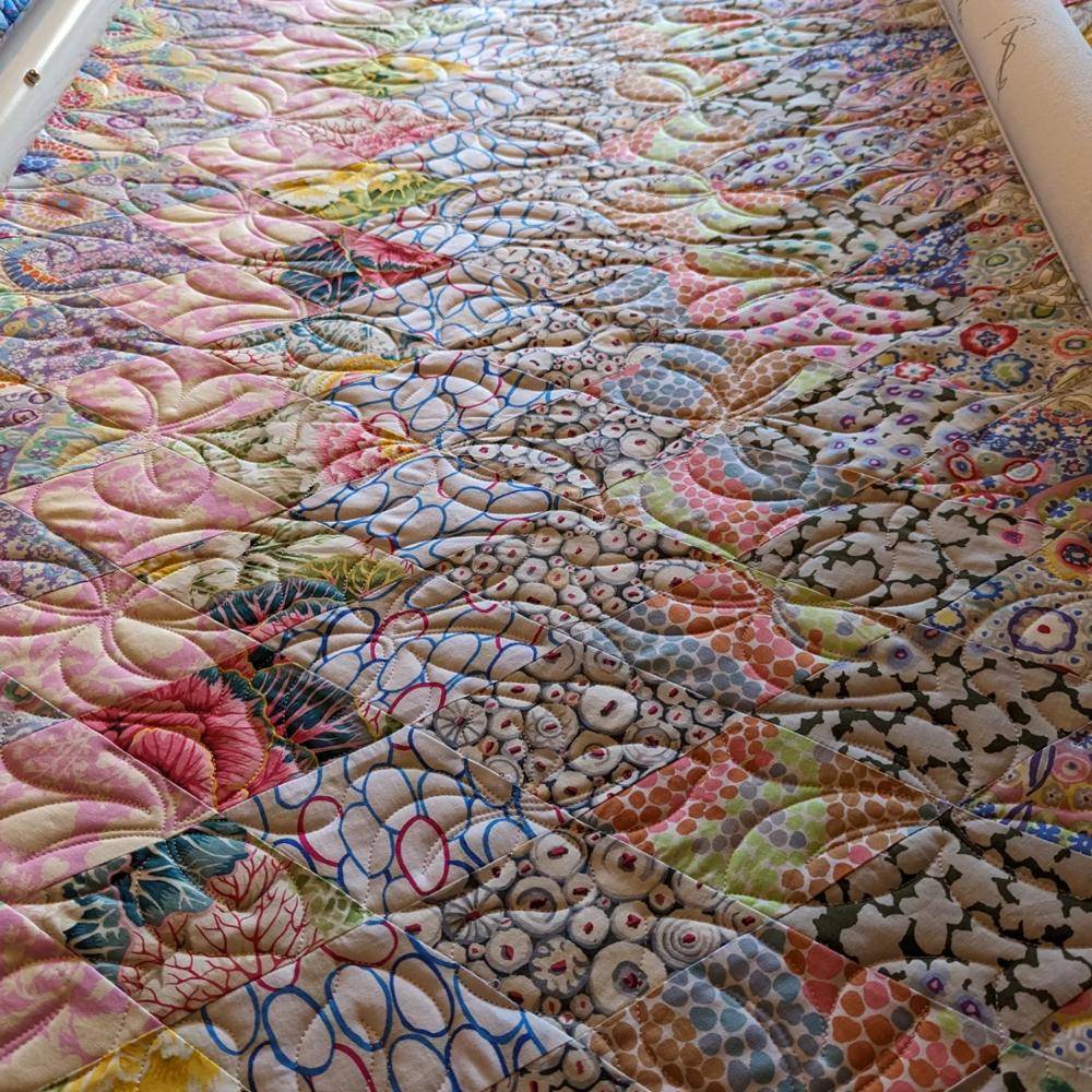 Vibrant Patchwork Quilt with Free-Motion Quilting